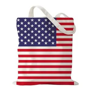 Small canvas tote bag with stars and stripes pattern on grass