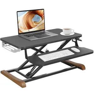 TooCust 26-inch desk converter with wooden feet and side cover on a home office desk