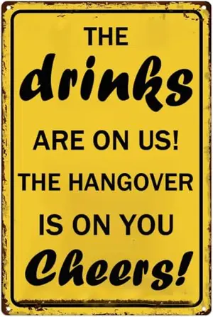 Vintage tin sign saying The Drinks Are On Us Cheers