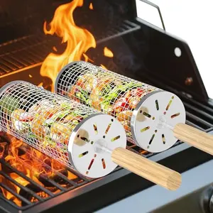 Two cylindrical stainless steel grill baskets with wooden handles on a wooden table