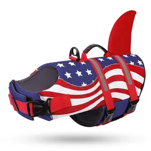 Dog wearing Queenmore USA flag life jacket with shark fin