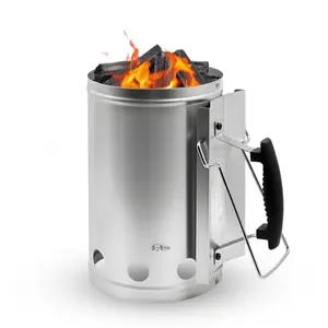 Joyagrill XL chimney starter with electroplated handle tilted over a grill