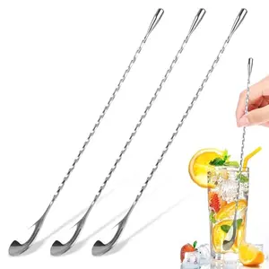 Three Okxiri 12-inch bar spoons with spiral handles and flat end on a wooden surface