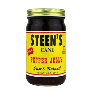Steen's Cane Pepper Jelly jar on a rustic table