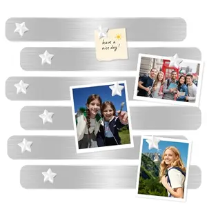 Magnetic board strips with white star magnets on a wall