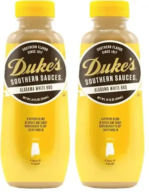 Two 14-ounce bottles of Duke's Alabama white sauce on a table