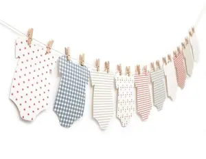 Patriotic onesie banner with clothespins and twine