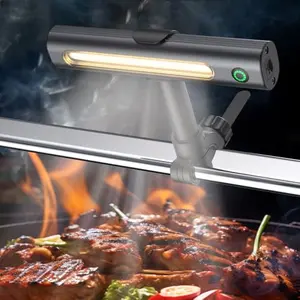 Anicooking rechargeable grill light with magnetic base and bracket attached to a grill handle