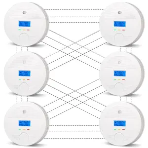Six white wireless interconnected smoke and carbon monoxide detectors with LCD display