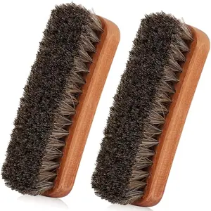 Two TAKAVU horsehair shine brushes with concave handles