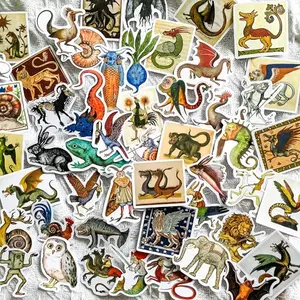 Vintage manuscript-style stickers of mythical creatures on wooden background