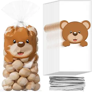 Clear cellophane bags with bear prints, tied with silver twist ties, filled with colorful gummies