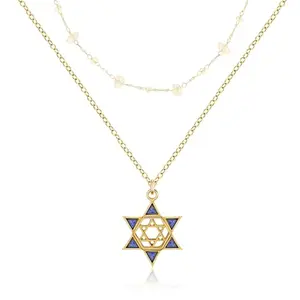 Layered necklace with gold Star of David pendant featuring blue crystal center