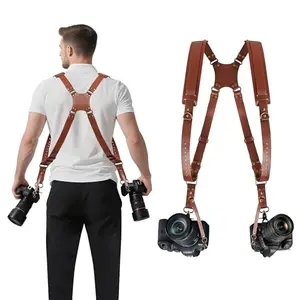 JUNART leather dual camera harness worn by a photographer