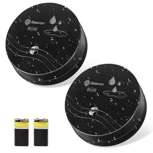Two black Geevon water leak detectors next to a 9V battery on a white background