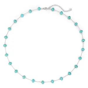 Silver plated beaded turquoise choker necklace on a display stand