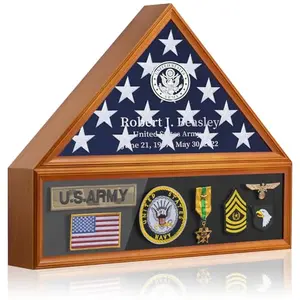 Brown pentagon-shaped flag display case with glass front, decorated with metal stickers and letters spelling '1776' on a table.