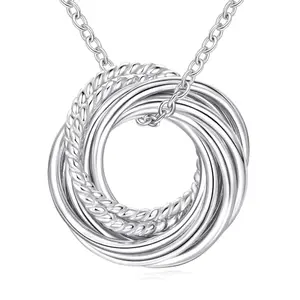 Nine polished sterling silver circles on a delicate chain, representing nine decades, with a matching birthday card