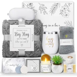 Joyliss sympathy gift basket with flannel blanket, mug, candle, and self-care items