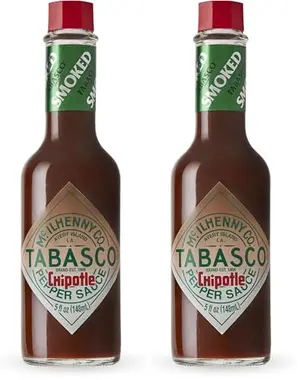 Two 5-ounce bottles of Tabasco Chipotle Pepper Sauce with smoky labeling
