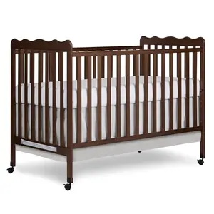 Dream On Me Carson convertible crib with locking wheels in walnut