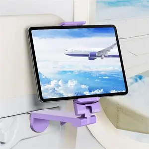 Purple airplane tablet mount clipped to an airplane seat back