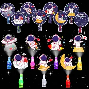 Space-themed Valentine's Day cards with finger lights and gold ribbons on a dark background
