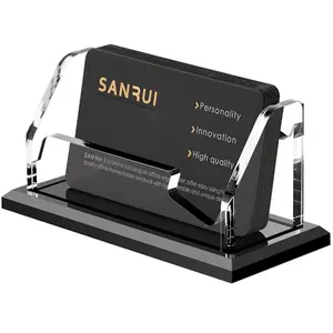 Clear acrylic business card holder with a black base, holding a stack of cream-colored cards