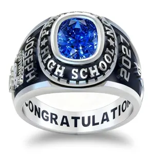 PhaedraOona men's class ring in sterling silver, customizable with engraving, next to graduation cap