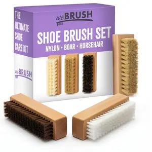 Three small wooden shoe brushes with different bristles