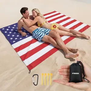 Frienda pocket-sized American flag picnic blanket with stakes on grass