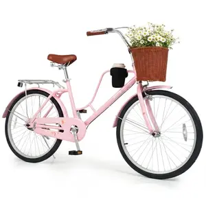 Pink 24-inch Goplus cruiser bike with cup holder and basket on a beach path
