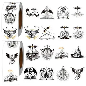 Roll of black vinyl dragon stickers with various designs on a white background