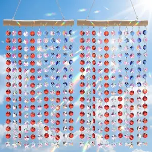Two crystal suncatcher wind chimes with red, blue, and clear crystals and an American flag design