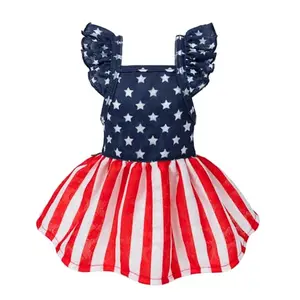 Small dog wearing Fitwarm red, white, and blue dress with star-print top and striped skirt, featuring ruffle straps