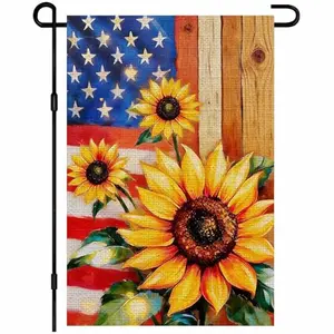 IVN sunflower garden flag with a large sunflower beside an American flag, set against a wooden background, hanging from a shepherd's hook in a lawn