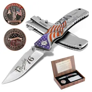 Commemorative folding knife with stonewashed blade, coin, and gift box