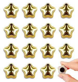 Small gold star-shaped magnets on a whiteboard