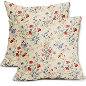 Sivirary watercolor floral patriotic pillow covers on an outdoor wicker chair