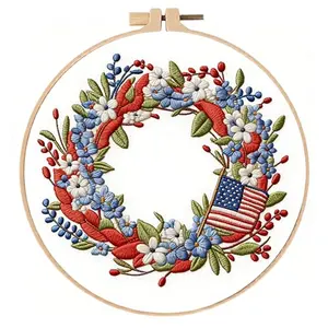 JJFox Independence Day Wreath Embroidery Kit with pre-printed water-soluble pattern, colorful threads, and plastic hoop on fabric
