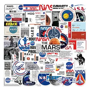 YWDXX NASA space stickers with rockets, planets, and astronauts on a laptop