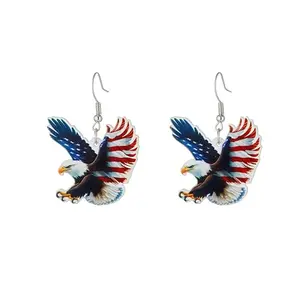 Bald eagle with American flag design dangle earrings on red, white, and blue background