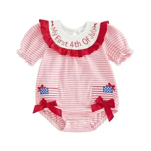 Baby girl in Ldaiyiu pink patriotic smocked romper with puff sleeves